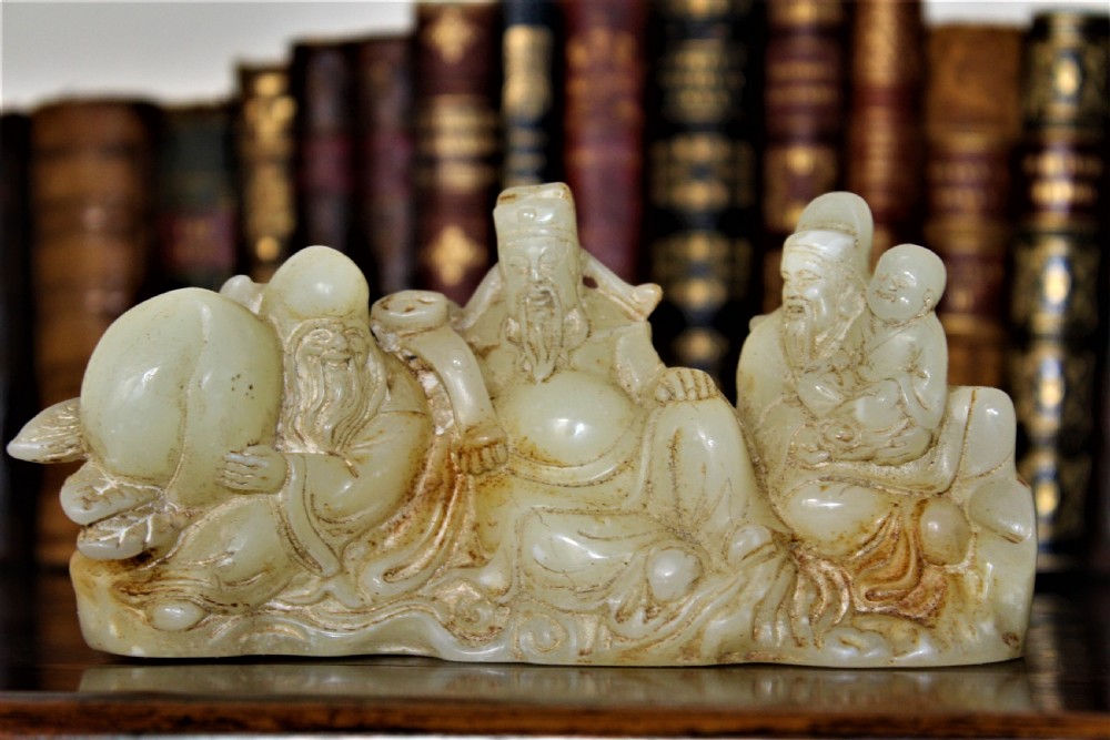 A finely carved Chinese hardstone possibly jade figural brush rest  View V