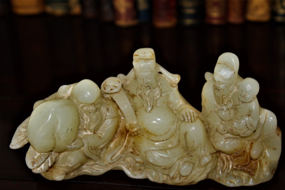 A finely carved Chinese hardstone possibly jade figural brush rest  View VI