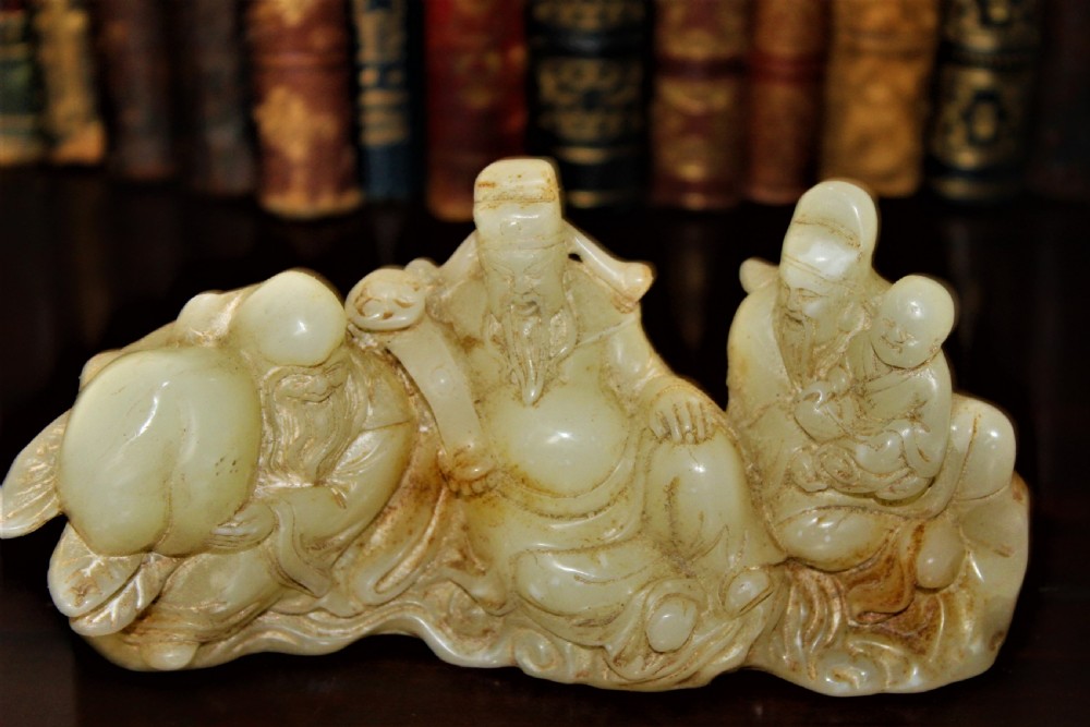 A finely carved Chinese hardstone possibly jade figural brush rest  View VII
