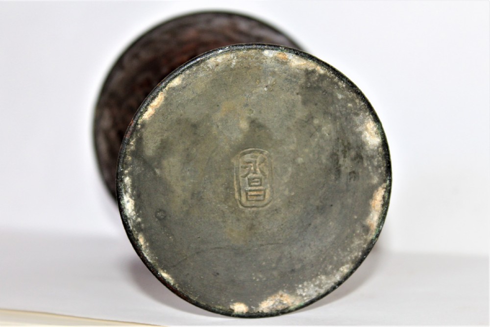A footed Chinese goblet featuring a dark brown carved coconut shell bowl mounted on a slender pewter stem and circular base. View VIII