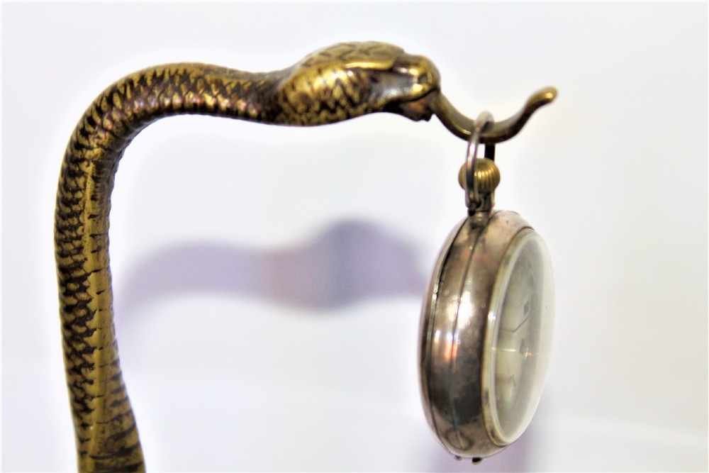 A tall and very stylish bronze / brass watch stand  View V