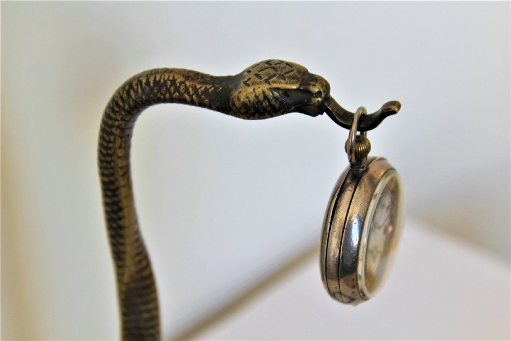A tall and very stylish bronze / brass watch stand  View X