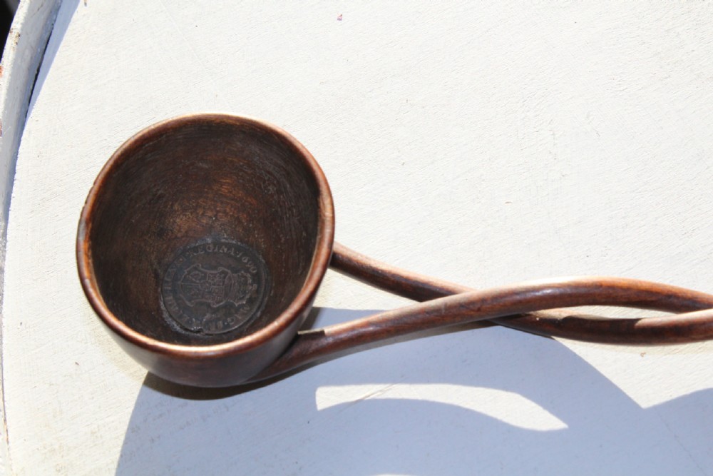 An unusual 18th Cen.carved hardwood toddy ladle made from one piece of wood  View VIII
