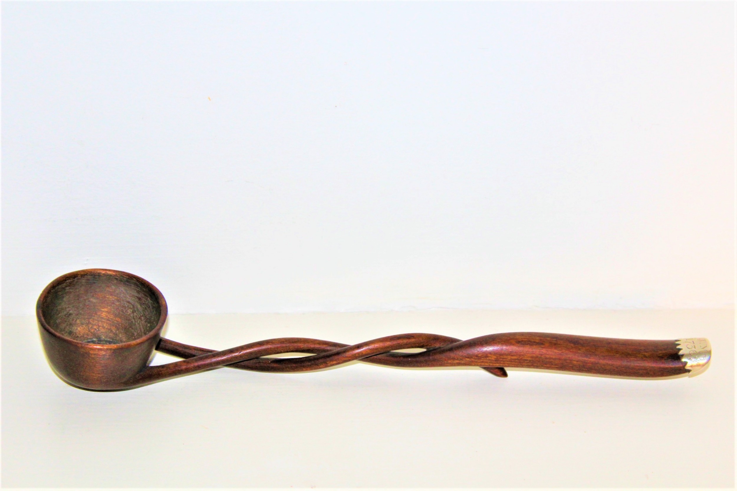 An unusual 18th Cen.carved hardwood toddy ladle made from one piece of wood 