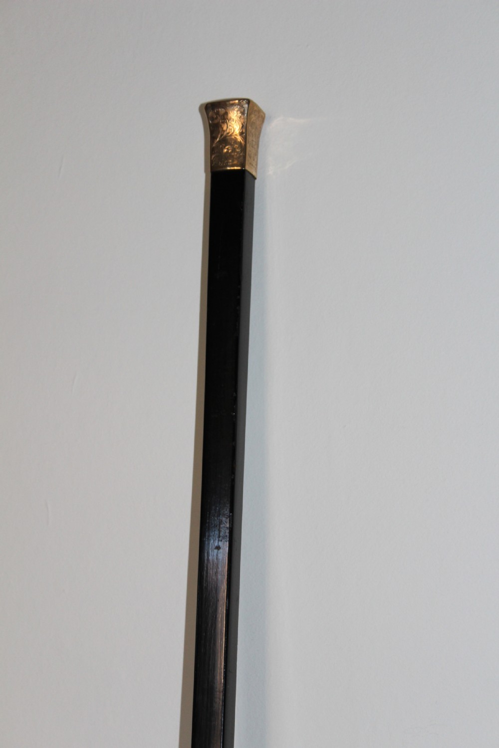A very stylish gold topped walking stick  View VII