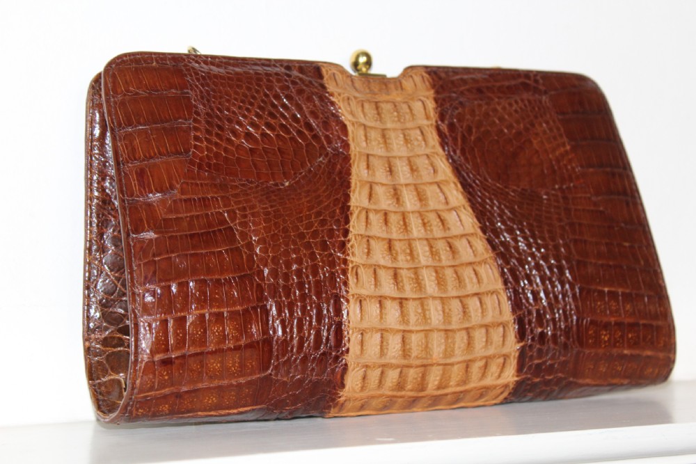 A 1930s Art Deco two-tone brown alligator skin handbag featuring a textured central hornback panel, top clasp closure, and a gilt metal chain strap. View IX