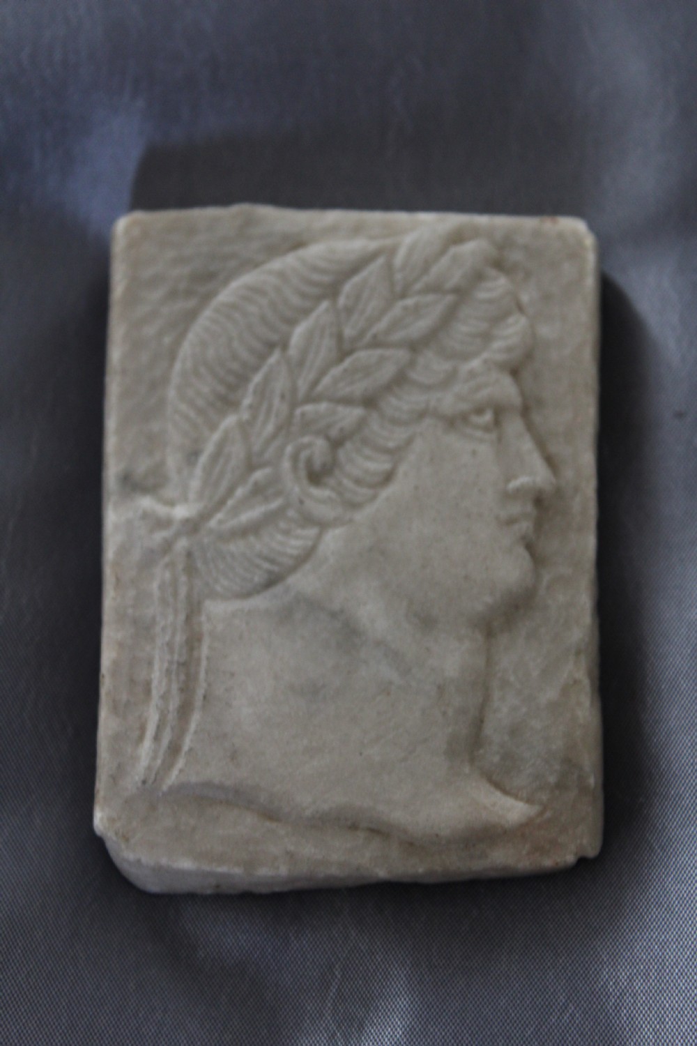 A Roman marble plaque of a Roman Emperor 