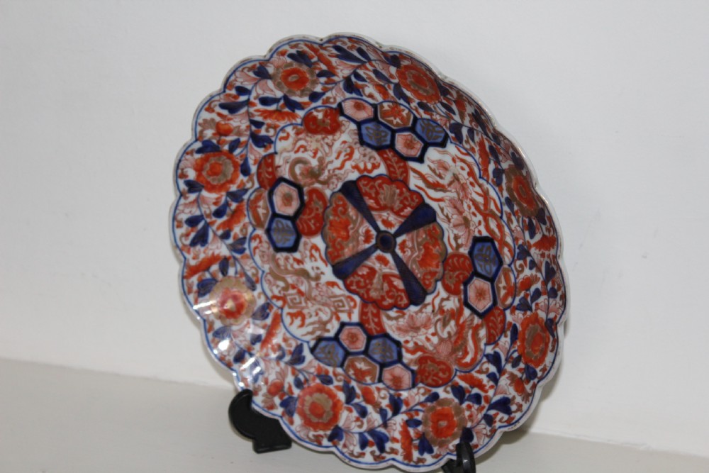 A pair of very finely painted and gilded imari plates View II