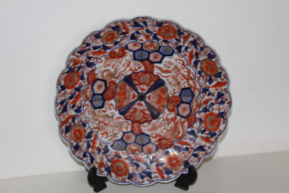 A pair of very finely painted and gilded imari plates View IV