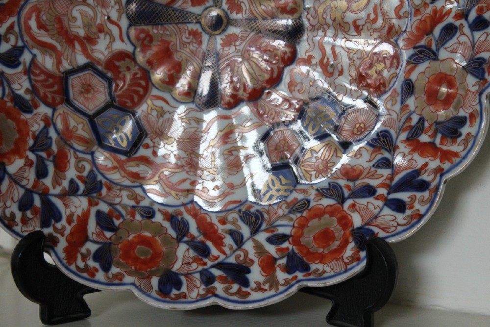 A pair of very finely painted and gilded imari plates View IX