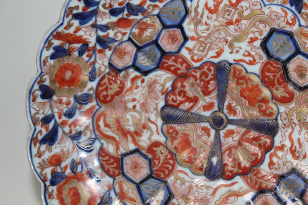 A pair of very finely painted and gilded imari plates View X