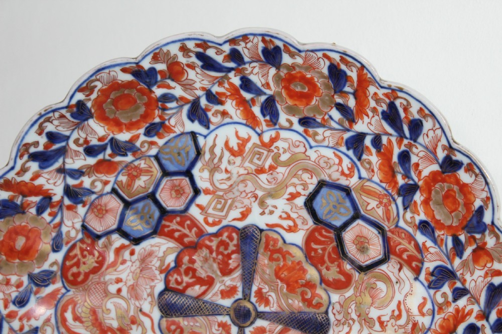 A pair of very finely painted and gilded imari plates View XI
