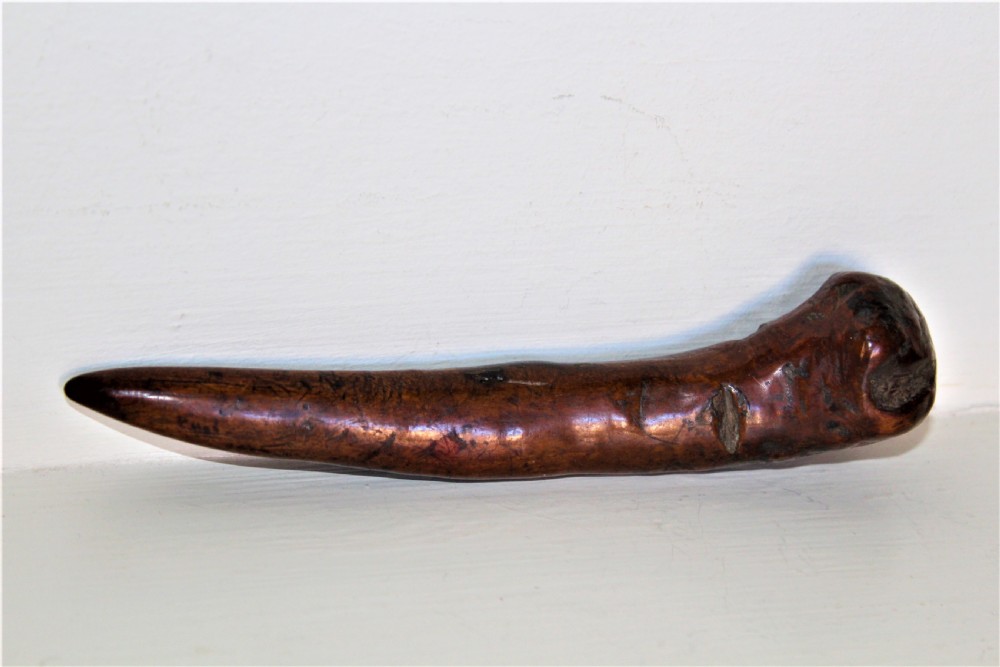 An early 19th-century curved wooden sailors fid featuring the carved date 1826 on its smooth polished body. View III