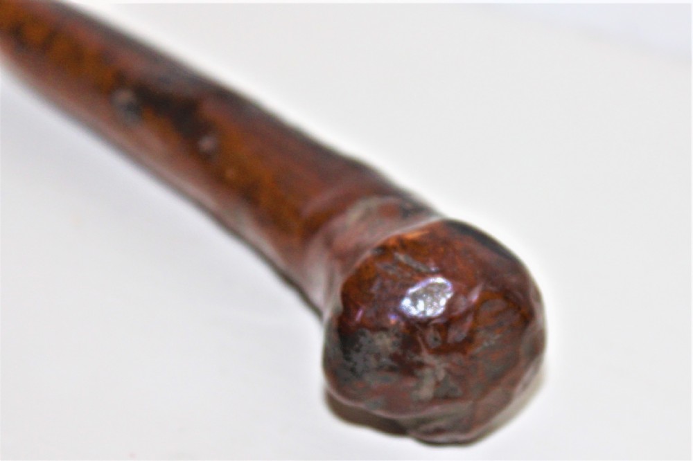 An early 19th-century curved wooden sailors fid featuring the carved date 1826 on its smooth polished body. View VI