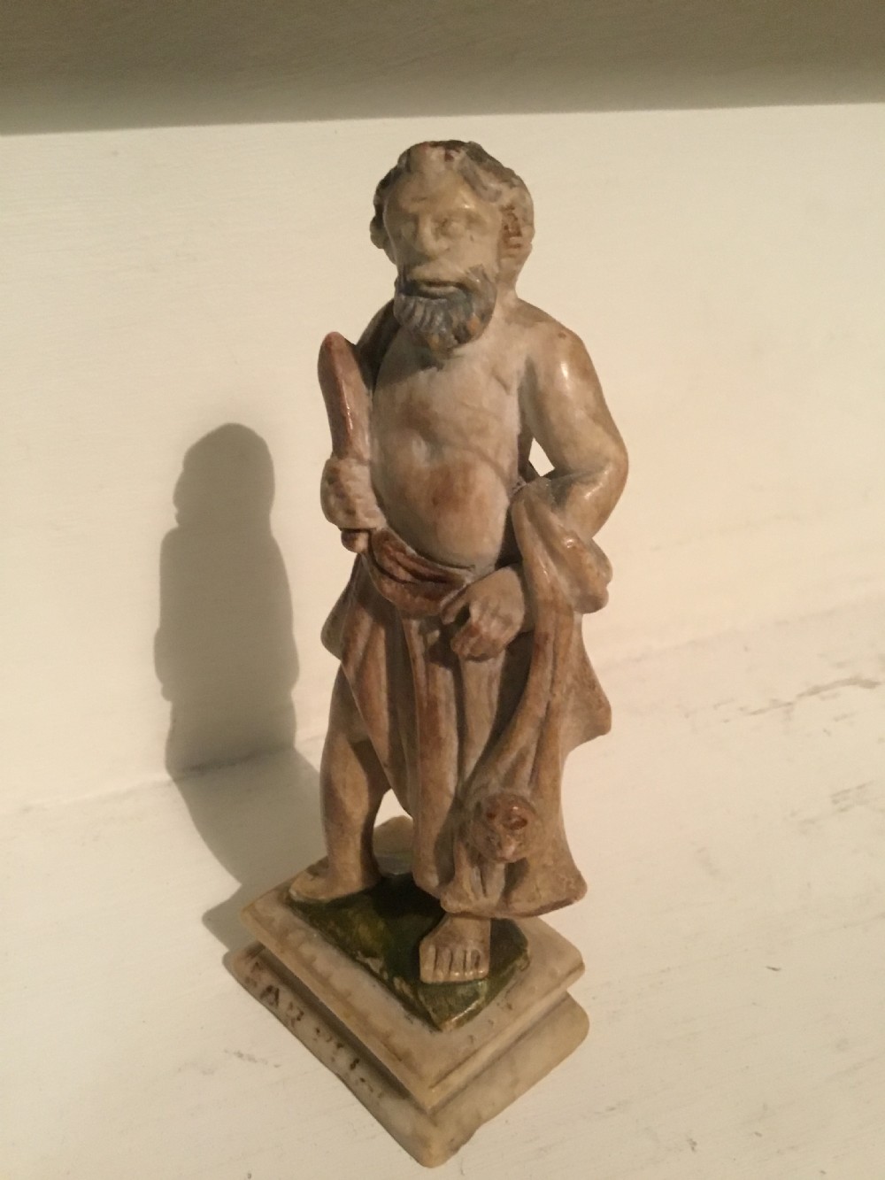 An early probably 17th century carved marble figure of a Roman philosopher