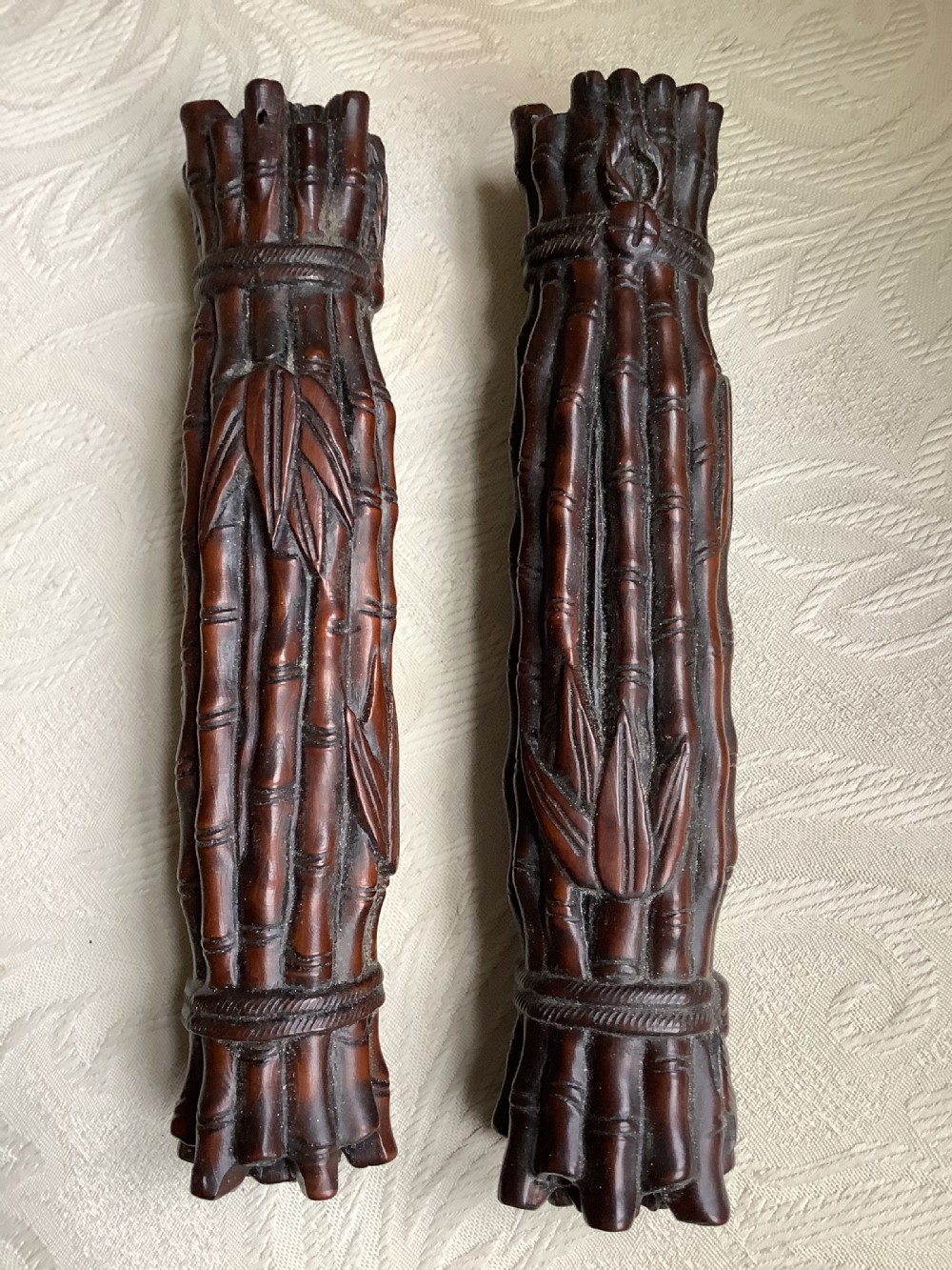 A pair of Chinese carved hardwood scroll weights  View III