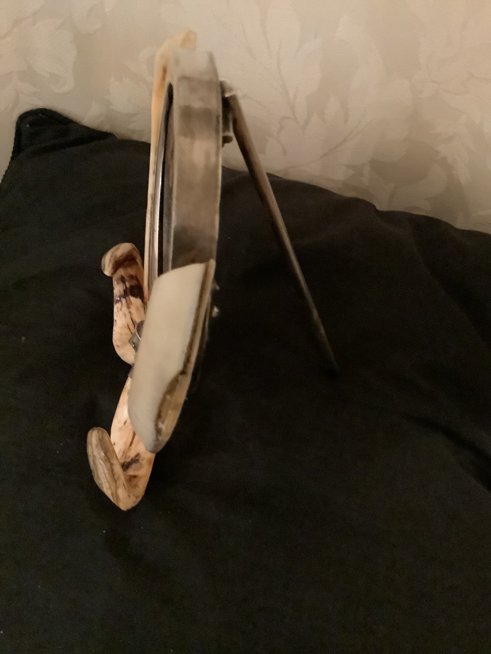 A  very attractive and decorative picture frame surrouded by boars tusks View V