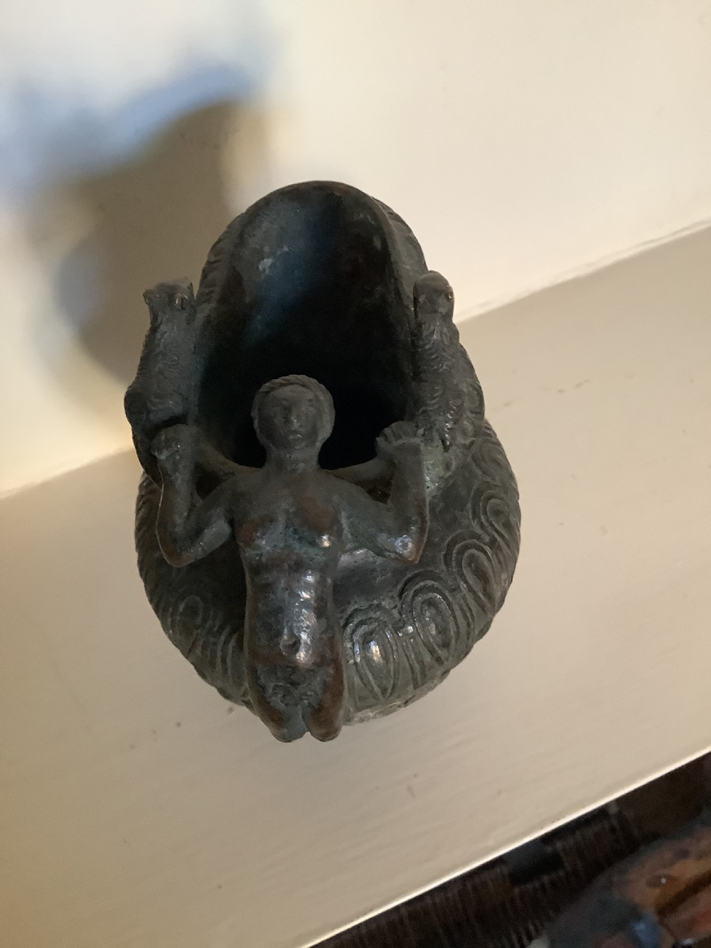 A patinated bronze jug with a flared fluted rim, a gadrooned body, and a sculpted handle depicting a mythological figure. View VII