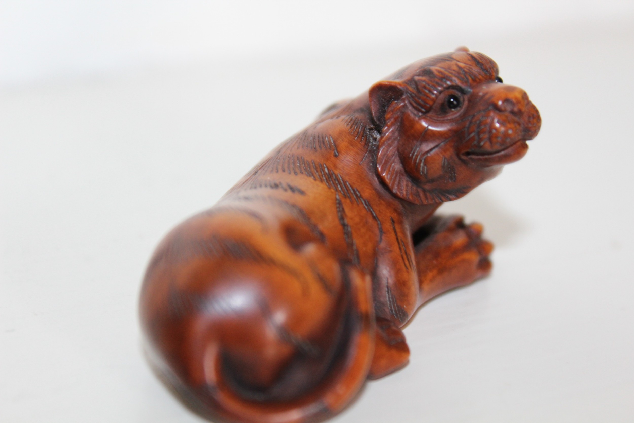 A finely carved boxwood Meiji period netsuke 