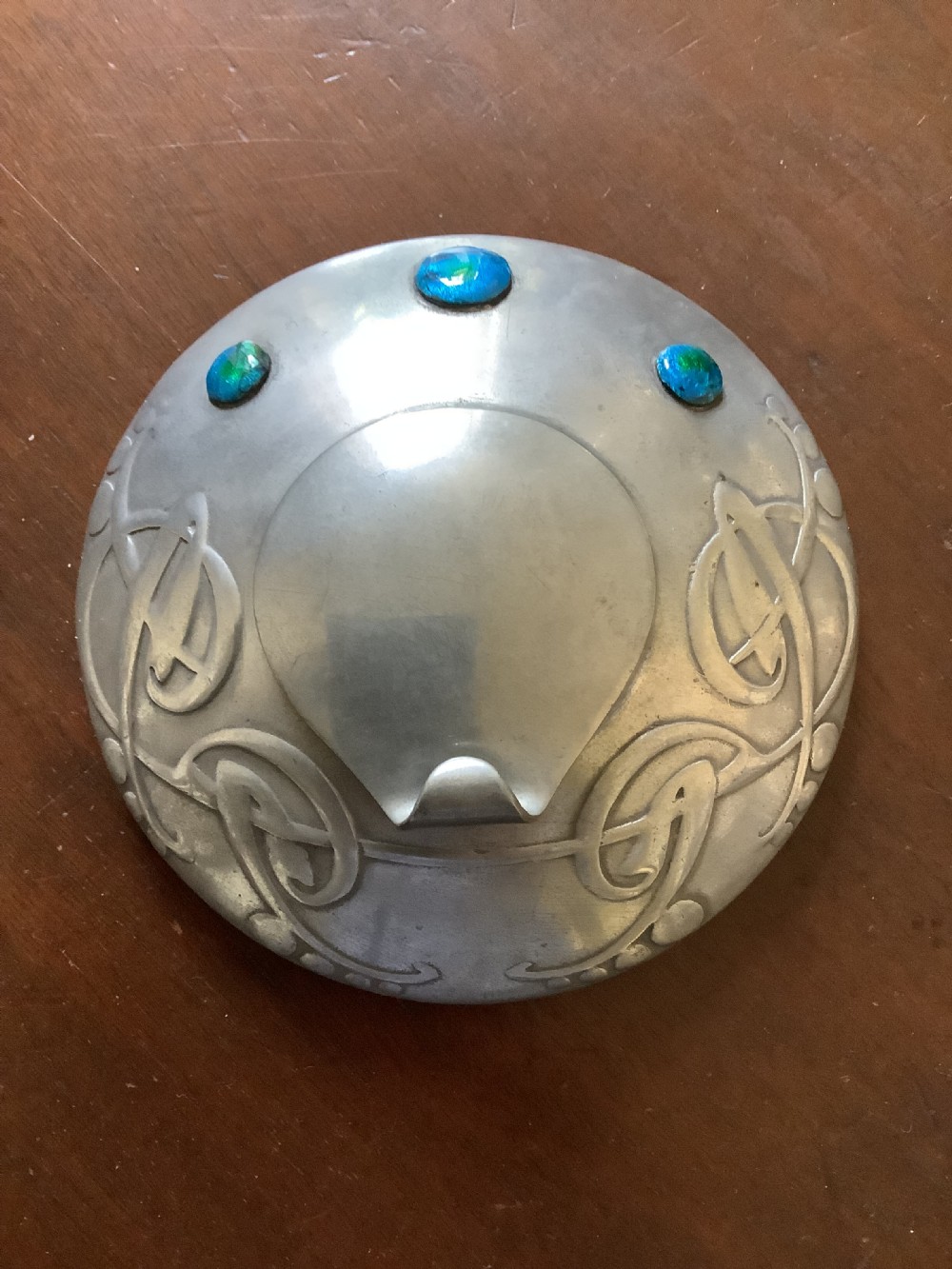A very stylish Arts and Crafts Tudric Pewter circular ink well and liner after a design by Archibald Knox