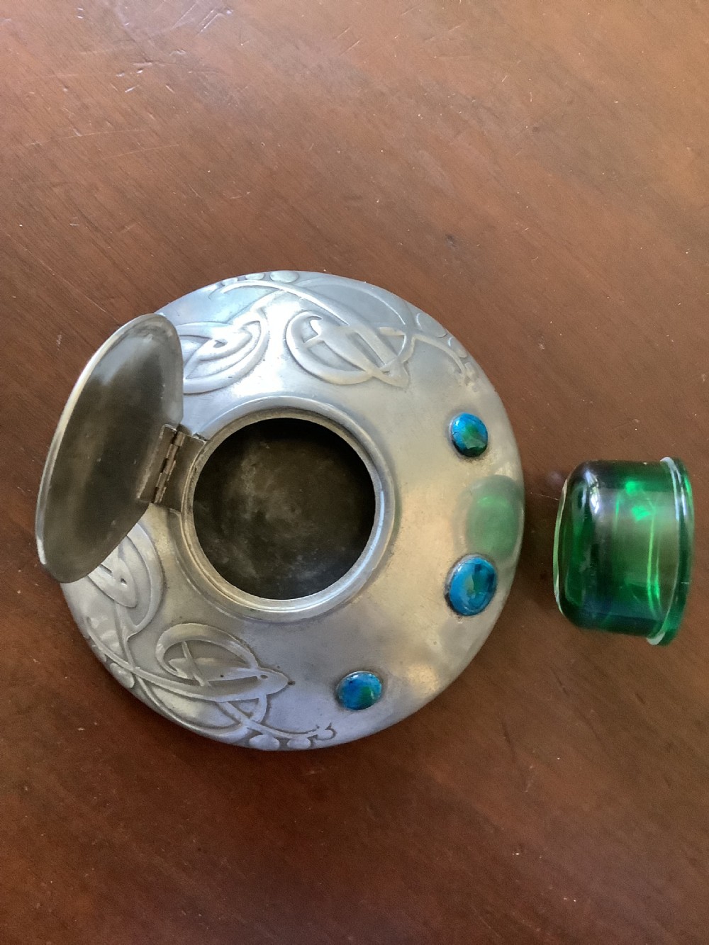 A very stylish Arts and Crafts Tudric Pewter circular ink well and liner after a design by Archibald Knox View VI
