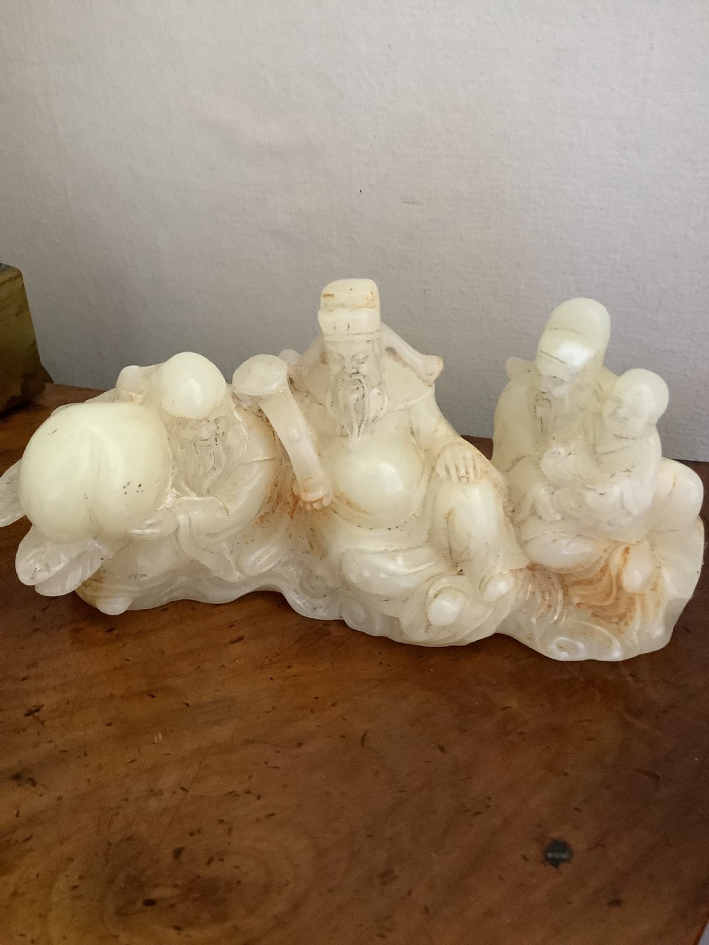 A finely carved Chinese hardstone possibly jade figural brush fest  View III