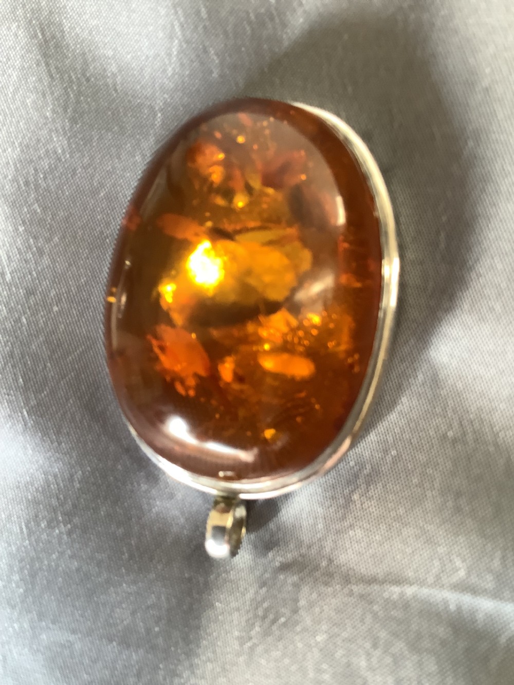 A wonderfully impressive large natural amber pendant a statement piece View II