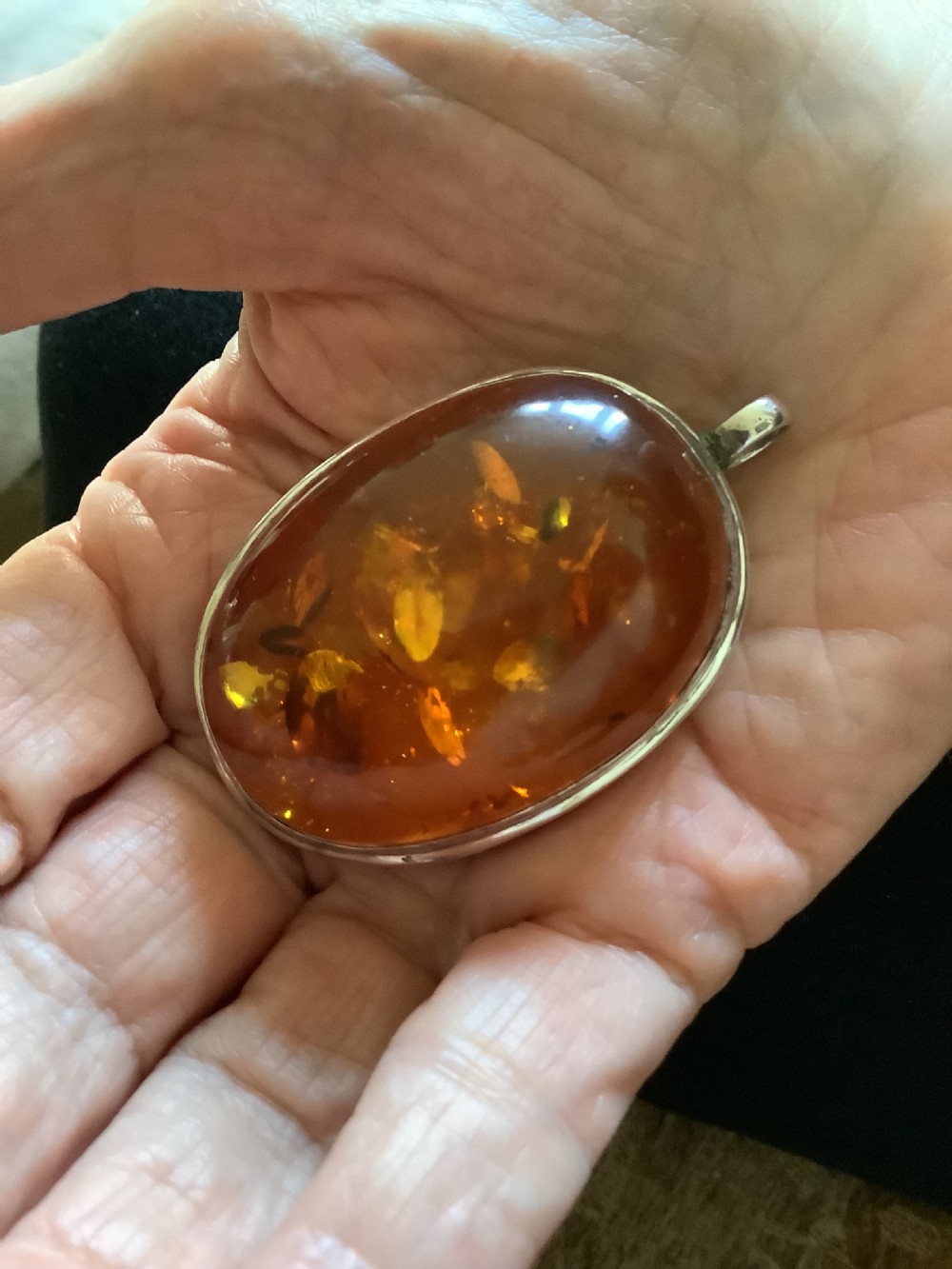 A wonderfully impressive large natural amber pendant a statement piece View III