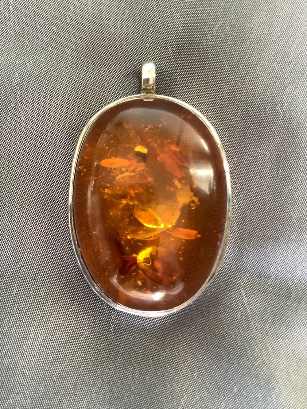 A wonderfully impressive large natural amber pendant a statement piece View V