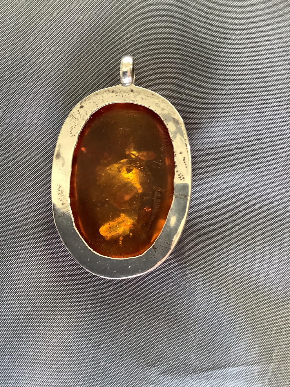 A wonderfully impressive large natural amber pendant a statement piece View VI
