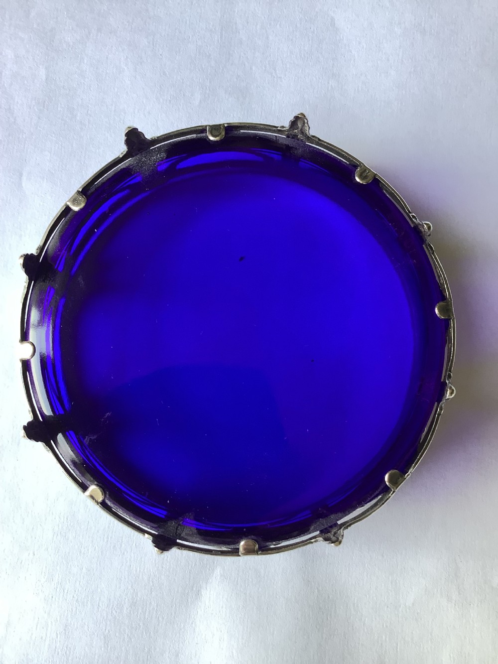 A round cobalt blue glass dish set within an Edwardian silver frame decorated with embossed floral garlands. View VIII