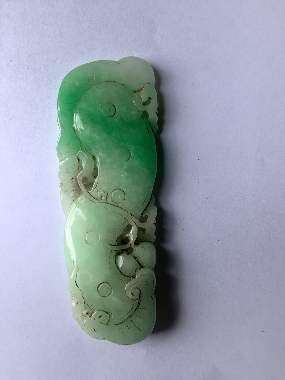 A very finely carved jade amulet in the form of a marine creature