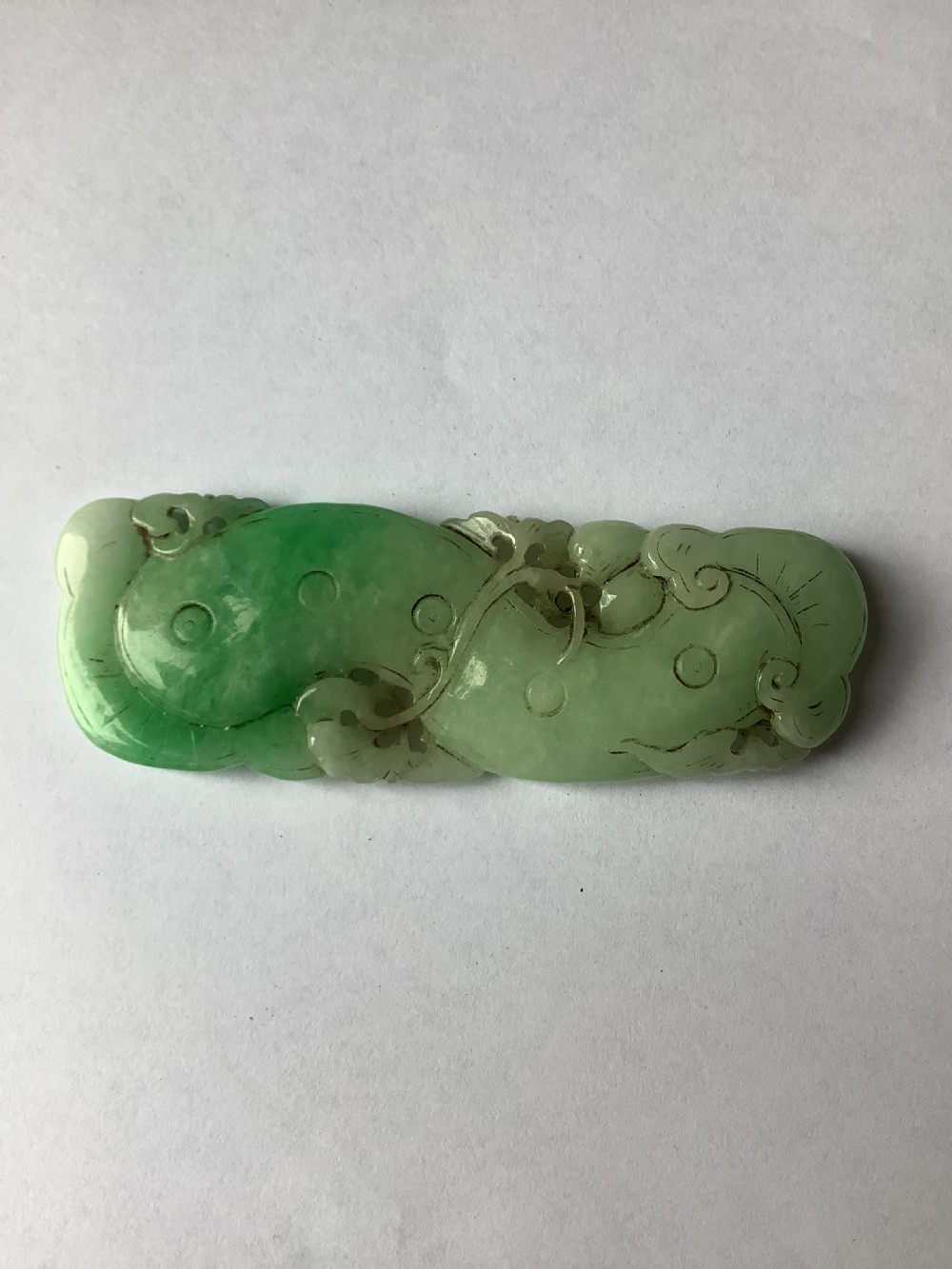 A very finely carved jade amulet in the form of a marine creature View II