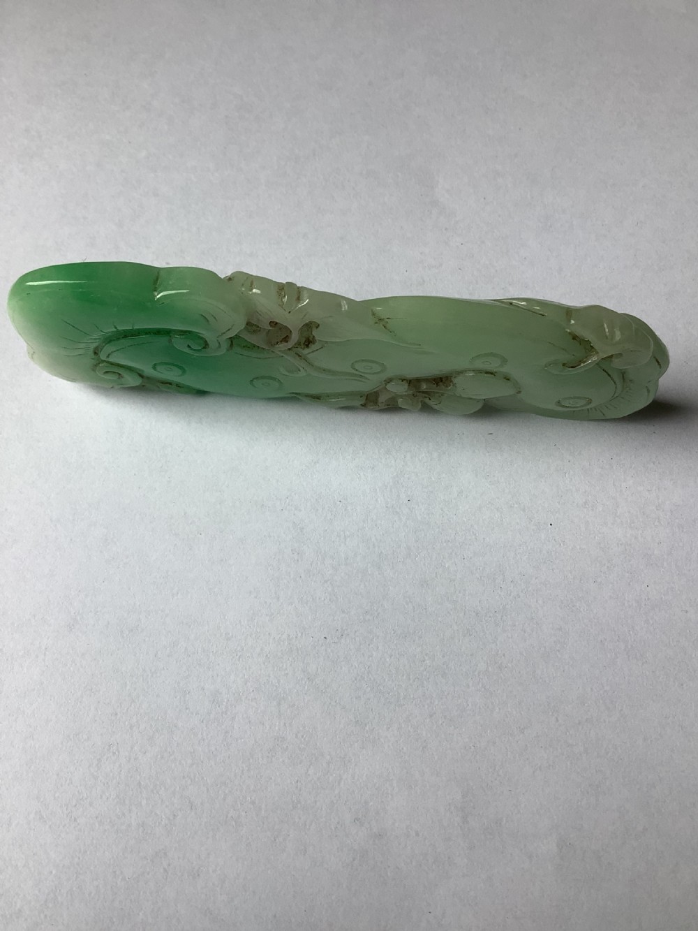 A very finely carved jade amulet in the form of a marine creature View IV