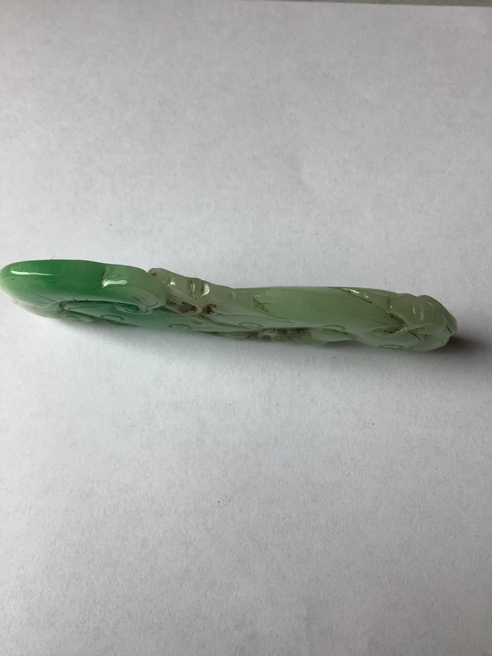A very finely carved jade amulet in the form of a marine creature View V