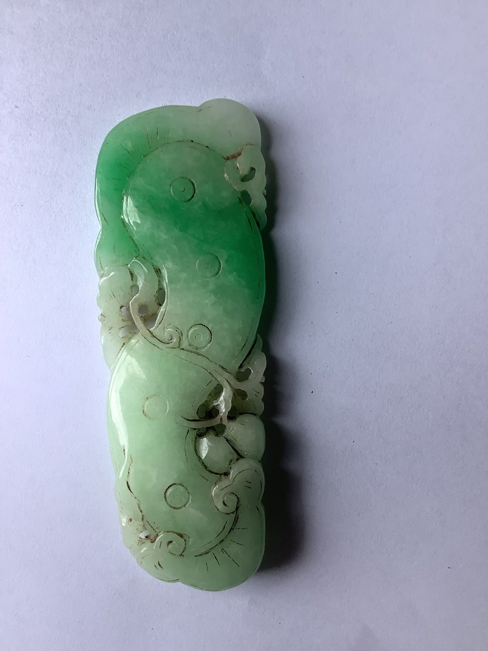A very finely carved jade amulet in the form of a marine creature View VI