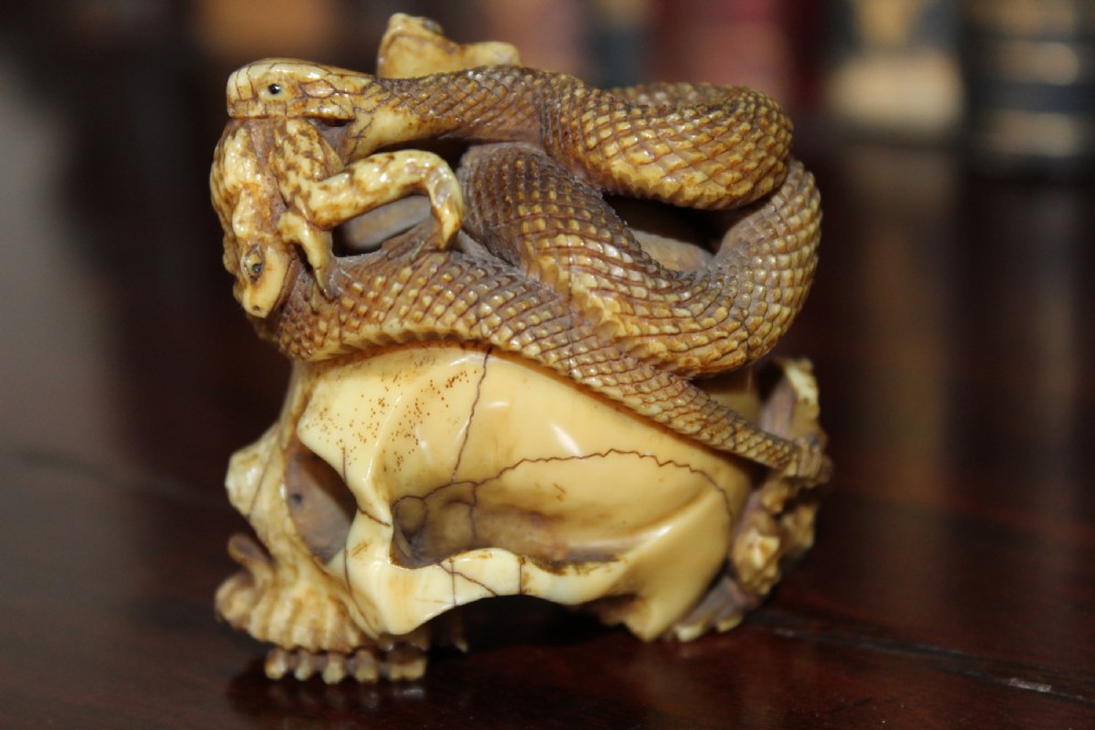 An extremely well carved stag horn memento mori skull View III