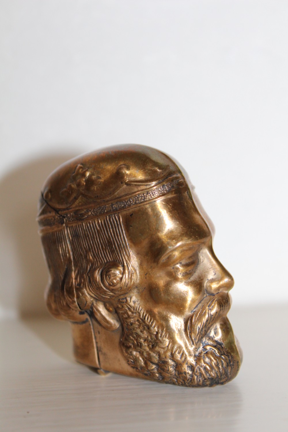 A finely cast and unusual brass vesta case in the form of a Roman classical bust