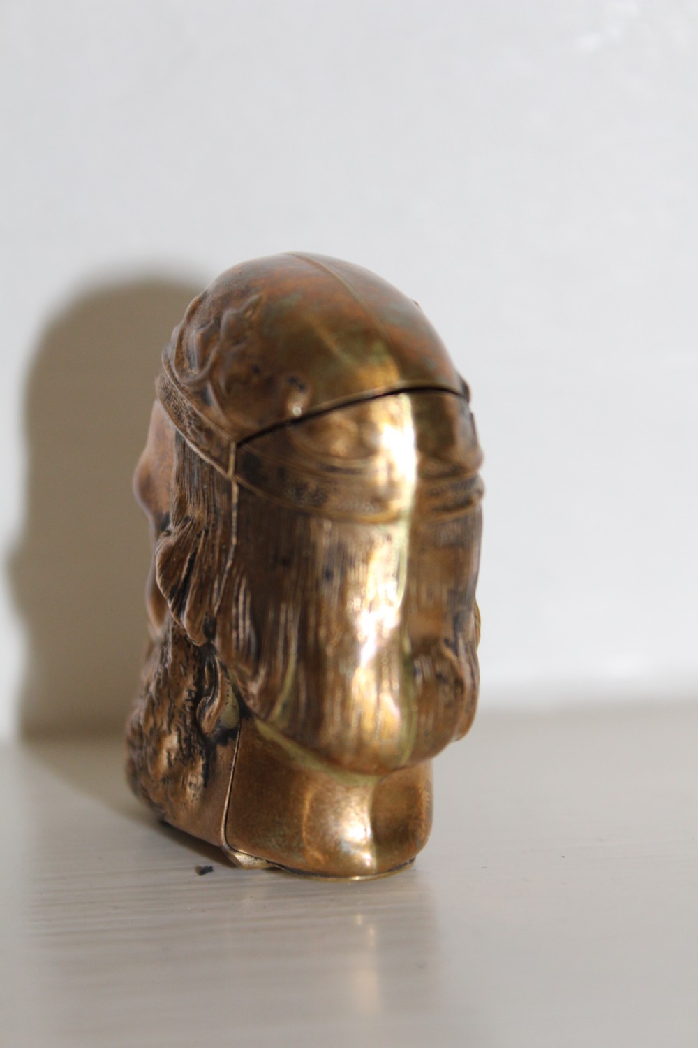 A finely cast and unusual brass vesta case in the form of a Roman classical bust View IX