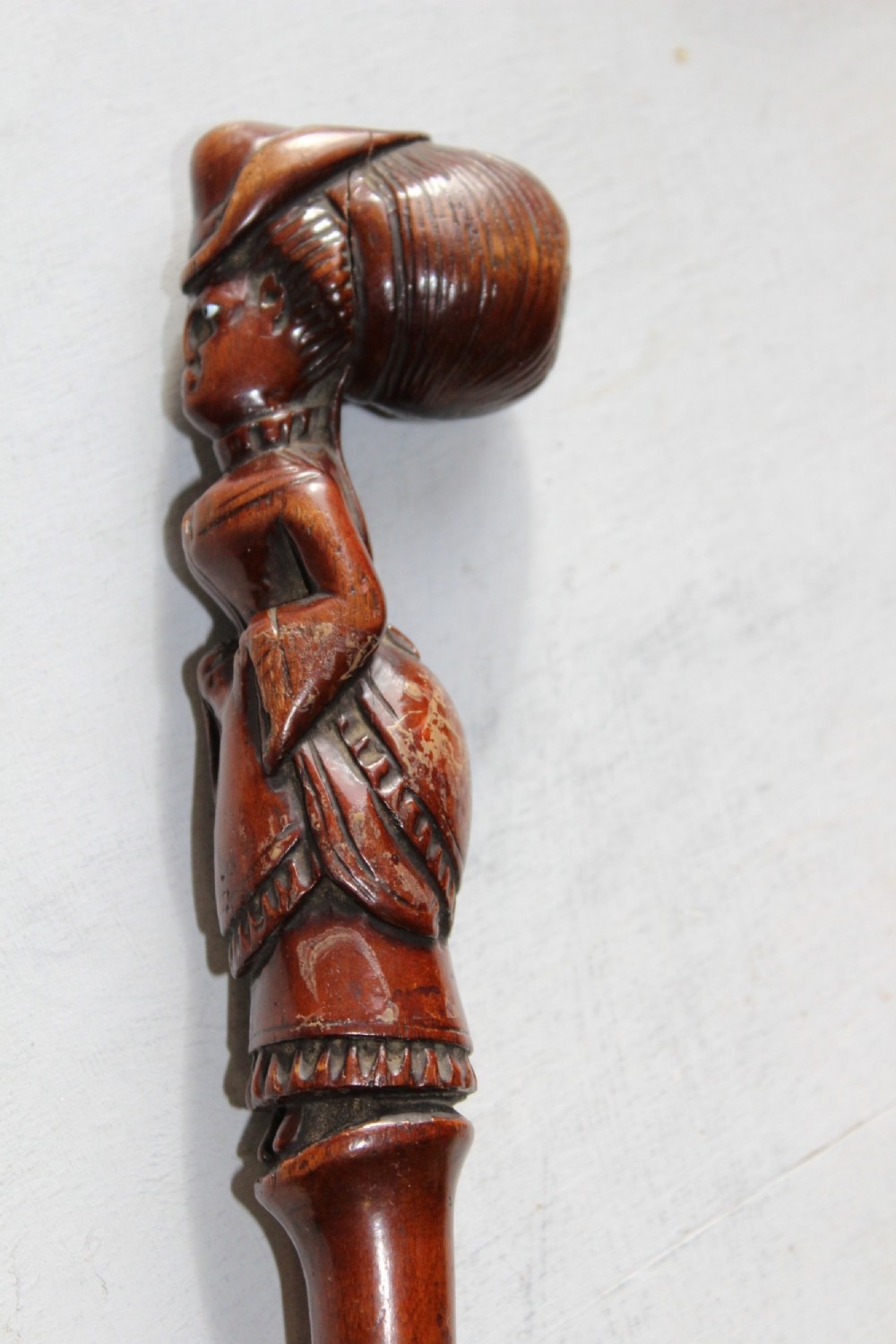 A superbly carved walking stick carved from one piece of wood