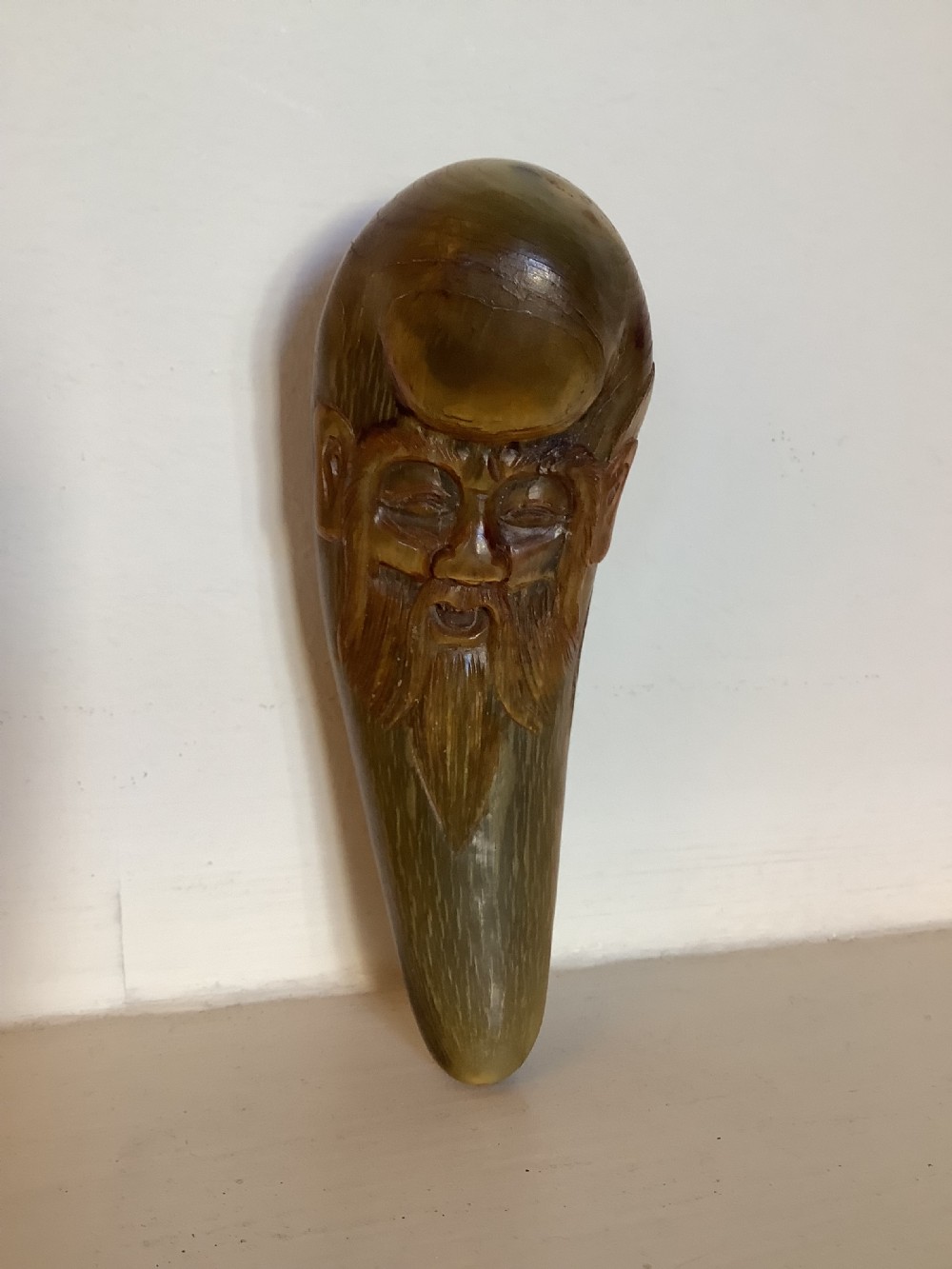 A very interesting carved horn object possibly a pendant worn by a holy man  View II