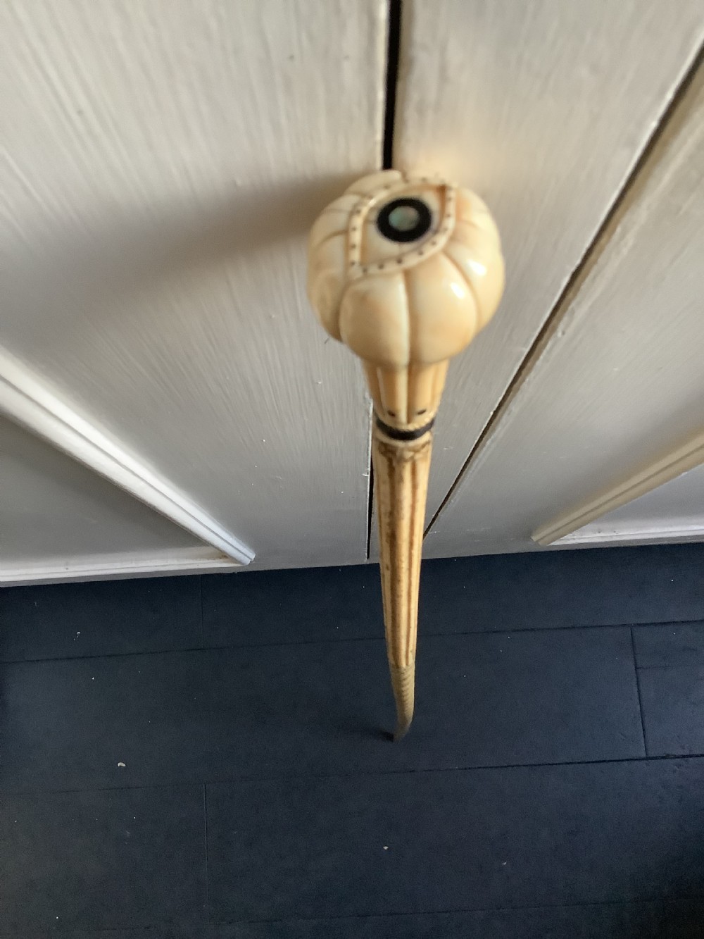 An interesting and well carved whale bone walking stick with a whale tooth carved handle View II