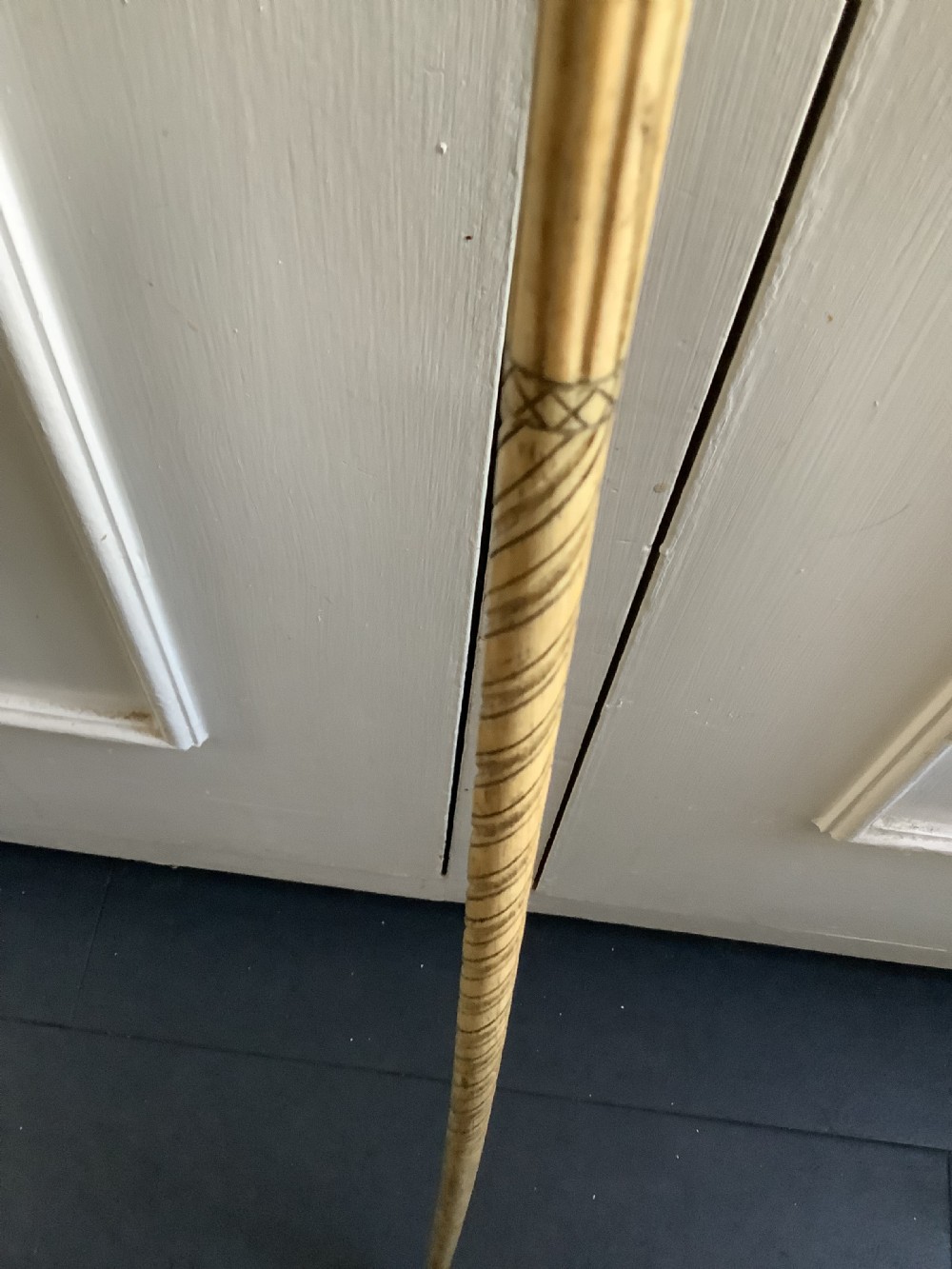 An interesting and well carved whale bone walking stick with a whale tooth carved handle View VI