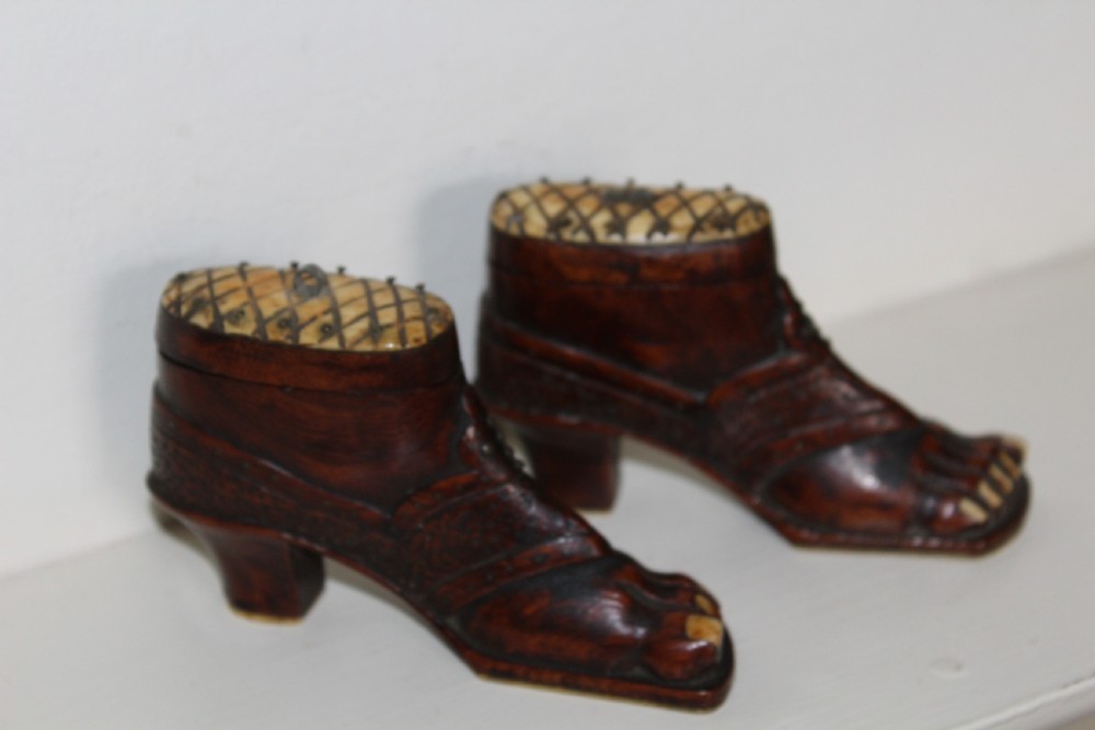 A pair of nineteenth-century carved wooden treen snuff boxes shaped like feet wearing heel shoes with bone toenails and cross-hatched inlaid lids. View VII