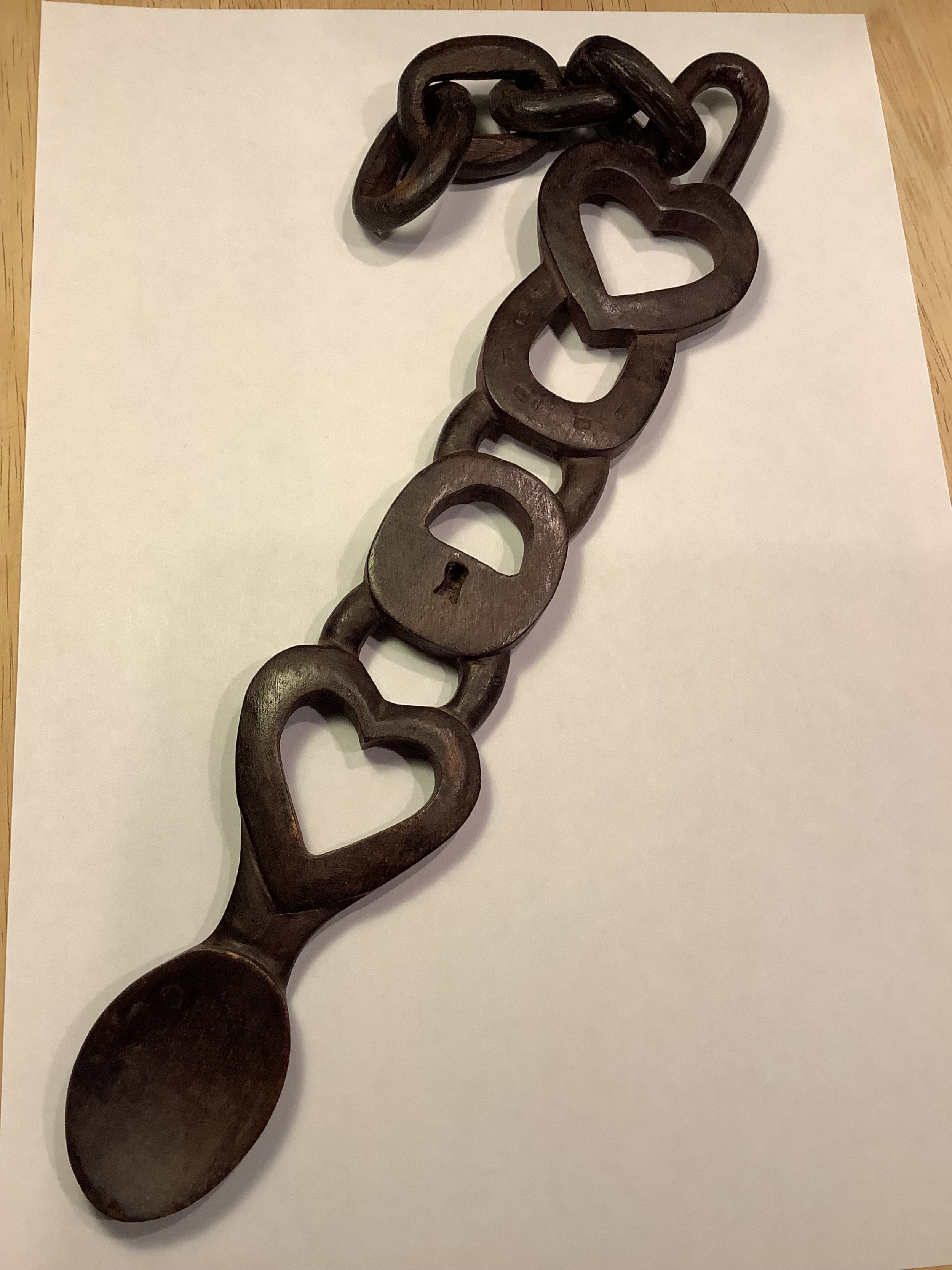 A very intricately carved Welsh love spoon carved from one piece of wood