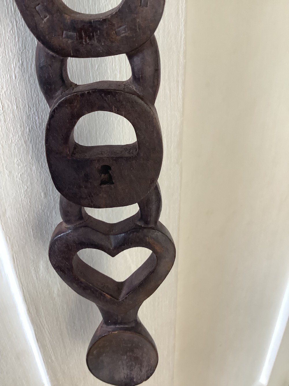 A very intricately carved wood Welsh love spoon carved from one piece of wood View III