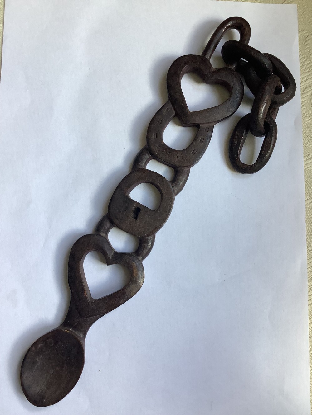A very intricately carved wood Welsh love spoon carved from one piece of wood View X