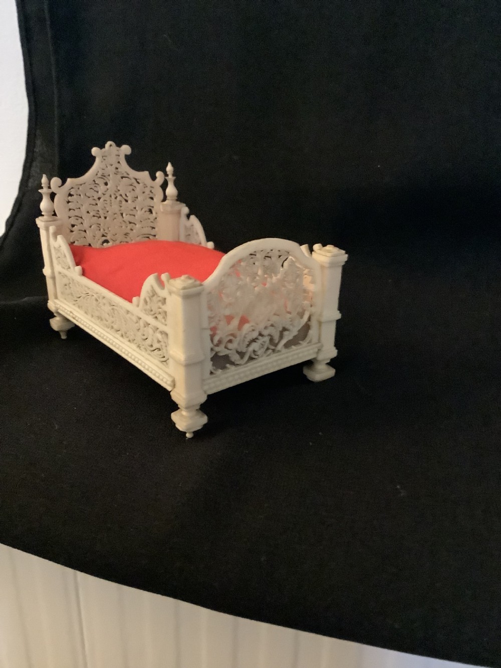 A miniature French carved bone boudoir suite featuring an ornate dressing table with mirror, a matching stool, and two side chairs with intricate pierced backs. View VII