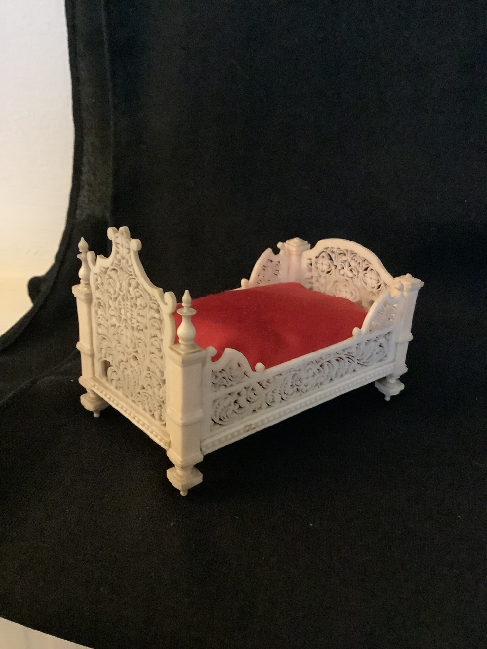 A miniature French carved bone boudoir suite featuring an ornate dressing table with mirror, a matching stool, and two side chairs with intricate pierced backs. View VIII