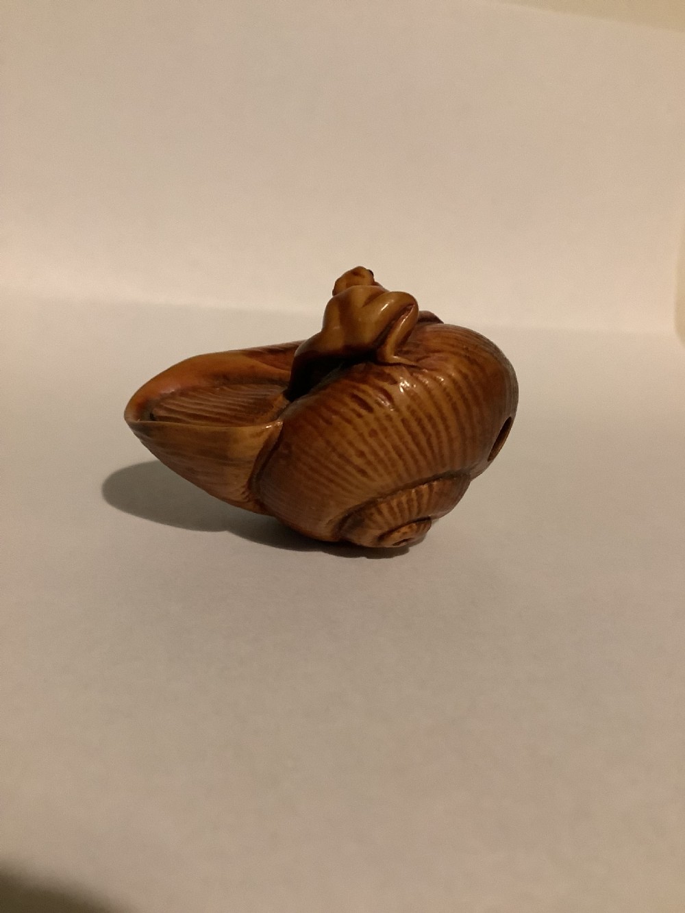 A very unusual and finely carved wood netsuke 
